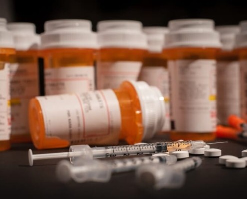 list of opioids strongest to weakest- pharmacy pill bottles with needles