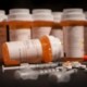 list of opioids strongest to weakest- pharmacy pill bottles with needles